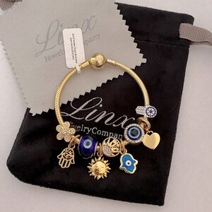 Linx Yellow Gold Snake Chain Bracelet with Hamsa and Evil Eye Themed Charms